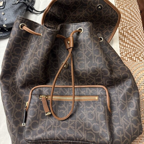 Calvin Klein Signature Monogram Drawstring Backpack – Brown